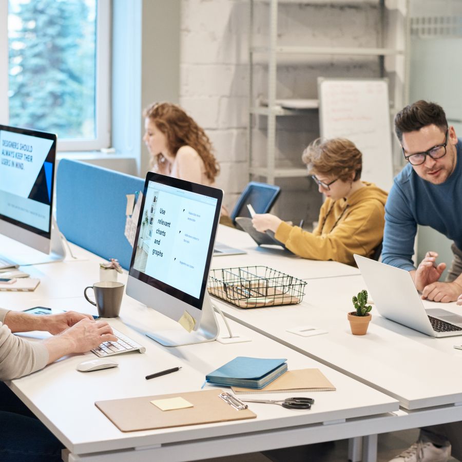 Team collaborating on a Microsoft Copilot rollout in a modern office